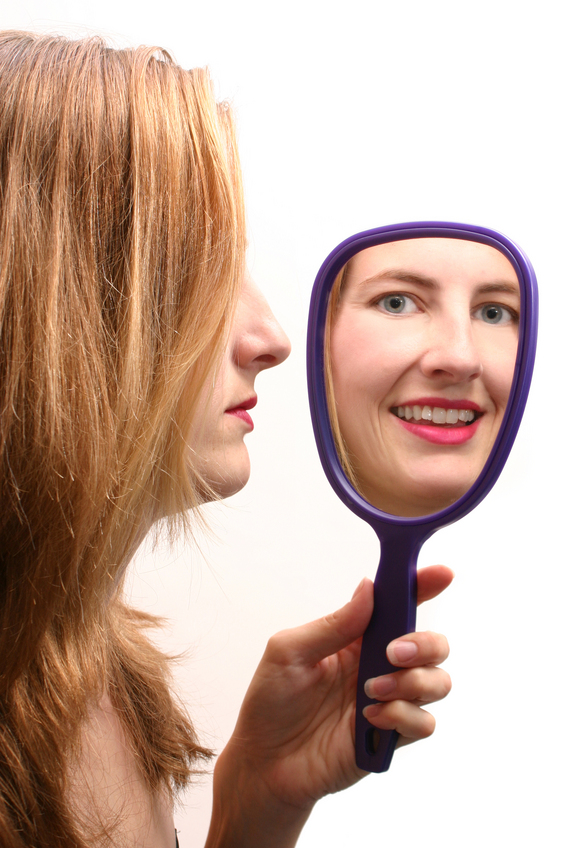Hypnosis for Winning - Woman Looking in the Mirror