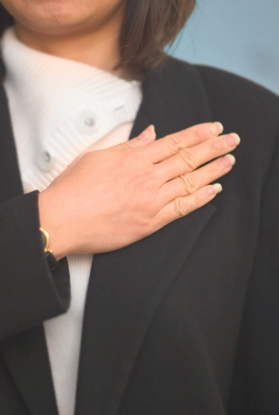 Hypnosis for Winning - Woman with Hand over her Heart
